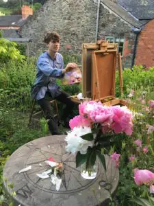 Daniel Yeomans painting in the garden
