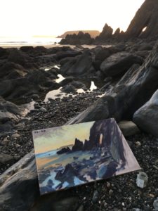 Artist painting the sunset on Marloes Sands in Pembrokeshire