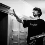 Photo of Artist, Daniel J Yeomans painting inside the Hotel Waldhaus Sils.